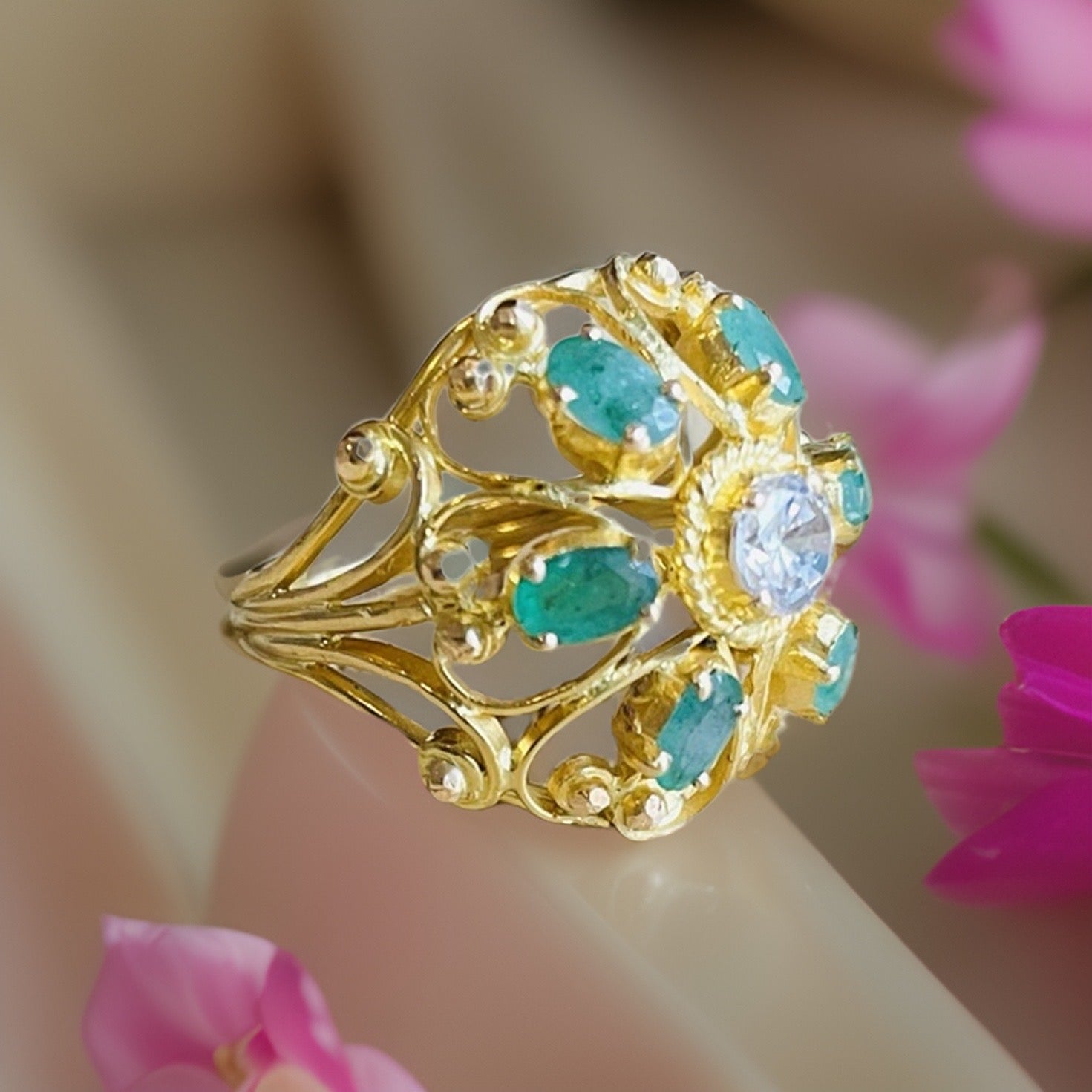 24 carat gold ring with emerald and zirconia